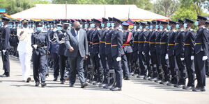 Inspector Sharon Ijeloit Oramisi Commanding final parade alongside President Uhuru Kenyatta at Kiganjo college on Wednesday January 19, 2022 