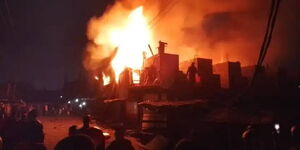 Footage of fire razing buildings at the Egesa estate in Mukuru kwa Ruben in Nairobi on October 16, 2024