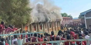 A dormitory in Teremi High School engulfed in fire