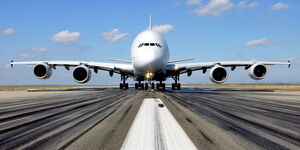 A plane preparing to take off at a runway in a photo captured in November 2014