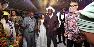 Former Prime Minister Raila Odinga and the bride and the groom dancing at a wedding in Lang'ata.