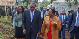 Former President Uhuru Kenyatta (left) and ex-Water CS Sicily Kariuki (right) in Kiambu County on December 2019 