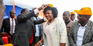 Former Prime Minister Raila Odinga (left) and former MP Elizabeth Ongoro.