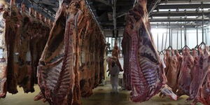 Freshly slaughtered meat hangs at an abattoir in Njiru, Nairobi County.