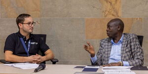 Deputy President Rigathi Gachagua (right) engages with Producer and Roaster Forum (PRF) boss Henry Wilson at a forum in Medellín, Colombia on September 14, 2023. 