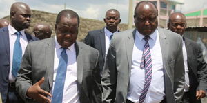 Interior Cabinet Secretary Fred Matiang'i and Nakuru Town West MP Samuel Arama after they had attended a church service at Califonia SDA church in Nakuru on November 10, 2018.