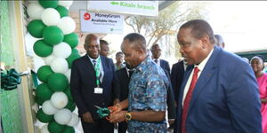 George Natembeya, Governor Trans Nzoia County (centre) cuts a ribbon to officially open Kingdom Bank Kitale Branch alongside Julius Sitienei, Kingdom Bank Board Director (right) and Kitale Branch Manager, Victor Ndalo (left) on May 20, 2024