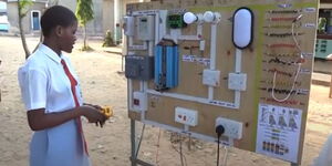 Glory Menza, a student from Kilifi High School showing a physics learning aid on Friday April 15, 2023