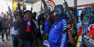 Haiti Gang Leader Jimmy Cherizier alias Barbecue ( in black cap) alongside other gang members 