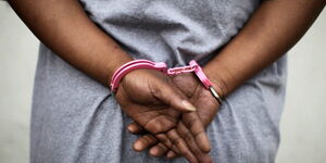 Undated picture of a woman in handcuffs 