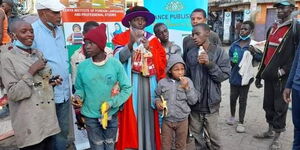 Dr Hassan Omari celebrating his graduation with Nairobi street children.