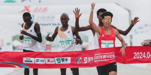 He Jie (in red) winning the Beijing Half Marathon on Sunday April 14, 2024