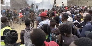 Residents watching a scene of a helicopter crash in Mwihoko, Kiambu County on Thursday, August 7, 2025.
