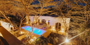 An aerial view of a swimming pool at a luxury homestay in Kenya