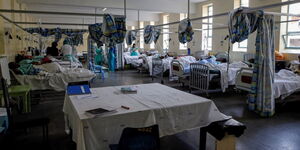 A local hospital in Kenya with nurses attending to admitted patients