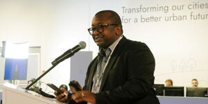 Housing Principal Secretary Charles Hinga addressing an event for Earth Negotiations Bulletin in June 2022.