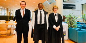 Kenyan doctor Hudson Alakonya (centre) attained a Ph.D. in oncology from the University of Oxford in 2023. He is flanked by his professors from the university.