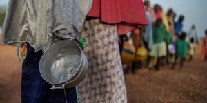 Women and children lining up for relief food in 2019.