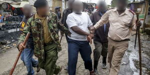 Police officers arrest a suspect in Nairobi in April 2020.