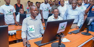 ICT CS Eliud Owalo (in glasses) at one of the Jitume labs in April 2023