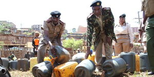 Regional administrators destroy illicit brew in Nyamira South in July 2020.