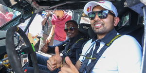 KCB Racing team driver Karan Patel and Cabinet Secretary Ministry of Youth Affairs, Creative Economy, and Sports Hon. Ababu Namwamba during the unveil of KCB sponsored drivers on February 14 in Nairobi.