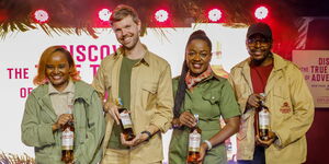 (From left to right) Lorraine Wairimu - Hunter’s Choice Brand Manager, Jonas Geeraerts, KWAL Commercial Director, Dr. Senorine Wasike - Head of Marketing KWAL and Dixy Adams – Hunter’s Choice Brand Executive pose for a photo with the newly branded bottle of Hunter’s choice during KWAL’s Hunter’s choice rebrand at the Kenya Wildlife Service Club House.
