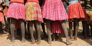Image of teen girls wearing traditional skirts
