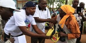 Kenyans Donating Food to an Elderly Woman