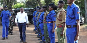 Interior CS Kithure Kindiki inspects a police parade.