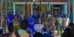 Interior Principal Raymond Omolo flanked by senior security officers,delivering a press statement at Harrambee House in Nairobi on December 4, 2024.