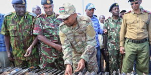 Interior CS Kithure Kindiki (Third left) inspects guns recovered in North Rift Valley on Friday, May 19, 2023, alongside a multi-agency team.