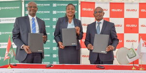 Group CEO CIC Insurance, Patrick Nyaga, Isuzu East Africa's Managing Director, Rita Kavashe and Cooperative Bank Retail and Business Banking Director, William Ndumia after signing Joint Assent Finance Partnership for MSMEs, School and learning institutions on Wednesday, March 13, 2024.  