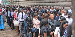 Kenyan youth queuing on Wabera Street in Nairobi, waiting for services on May 26, 2018. 