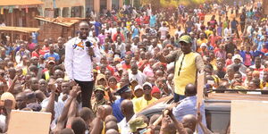 UDA founding member Joe Khalende (left) addressing a rally alongside President William Ruto on January 5, 2022