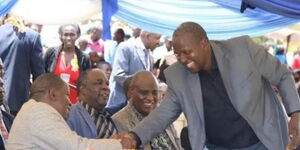 KNUT National Treasurer John Matiang'i greets his brother Interior CS Fred Matiang'i at a previous function