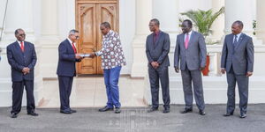 resident Uhuru Kenyatta receives findings of a tribunal chaired by  Justice (Rtd.) Alnashir Visram