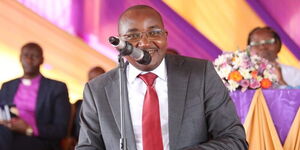 Juja MP George Koimburi speaking in a church service 