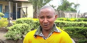 Photo of Kenyan athlete Julius Ndirangu speaking to the press in October 2023. 