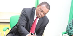 Attorney General Justin Muturi taking notes during a meeting on Wednesday April 12, 2023