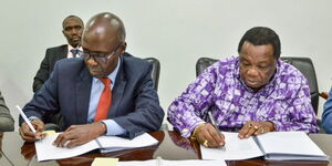 Kakuzi General Manager, Human Resources Wilson Odiyo (left) and COTU Secretary General Francis Atwoli signing CBA on January 10, 2023.