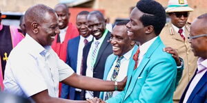 President William Ruto shaking hands with Kasmuel McOure