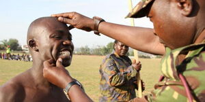 A KDF soldier conducting a recruitment exercise