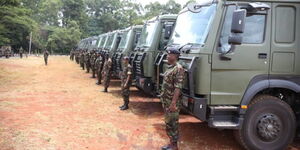 KDF soldiers stand in front of military vehicles procured from China on March 2022.
