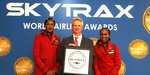 From Left to Right- Kenya Airways Flight Attendant Beatrice Chepkorir, General Manager Sales Europe, Middle East, Greater India Asia, Americas and West Africa Tom Reeves, and Flight Attendant Francisa Kibulo posing with the award at the ceremony.