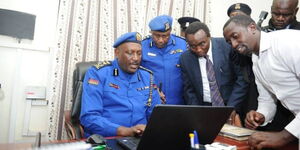 Former Inspector General of Police Hilary Mutyambai inaugurating a Digital Occurrence Book (OB), at Kasarani Police Station in 2019.