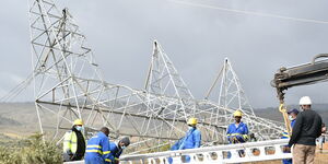 Kenya Power engineers repair a collapsed pylon.