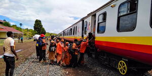 People boarding a commuter train