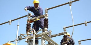 Kenya Power engineers working on an electricity line in Nairobi on February 15, 2023.