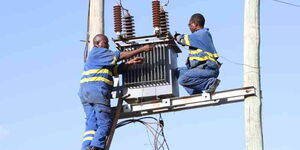 Kenya Power technicians upgrading a major power line in Kenya 